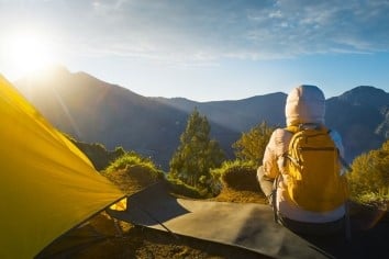 backpacker and tent