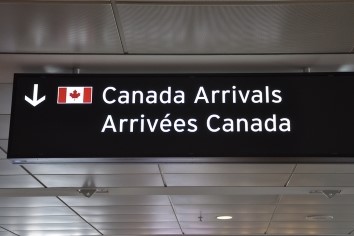 Canada arrivals sign