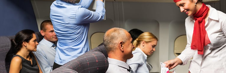 Air hostess talking to passenger 