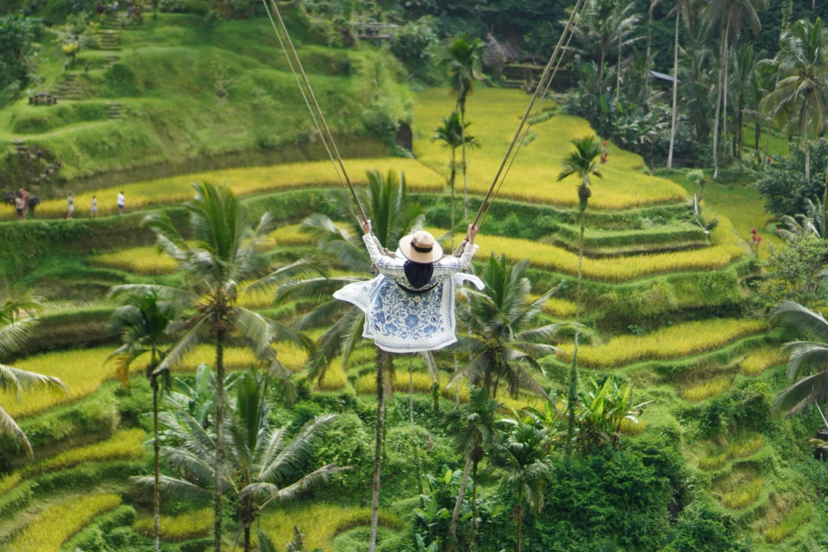 woman on giant swing in b ali