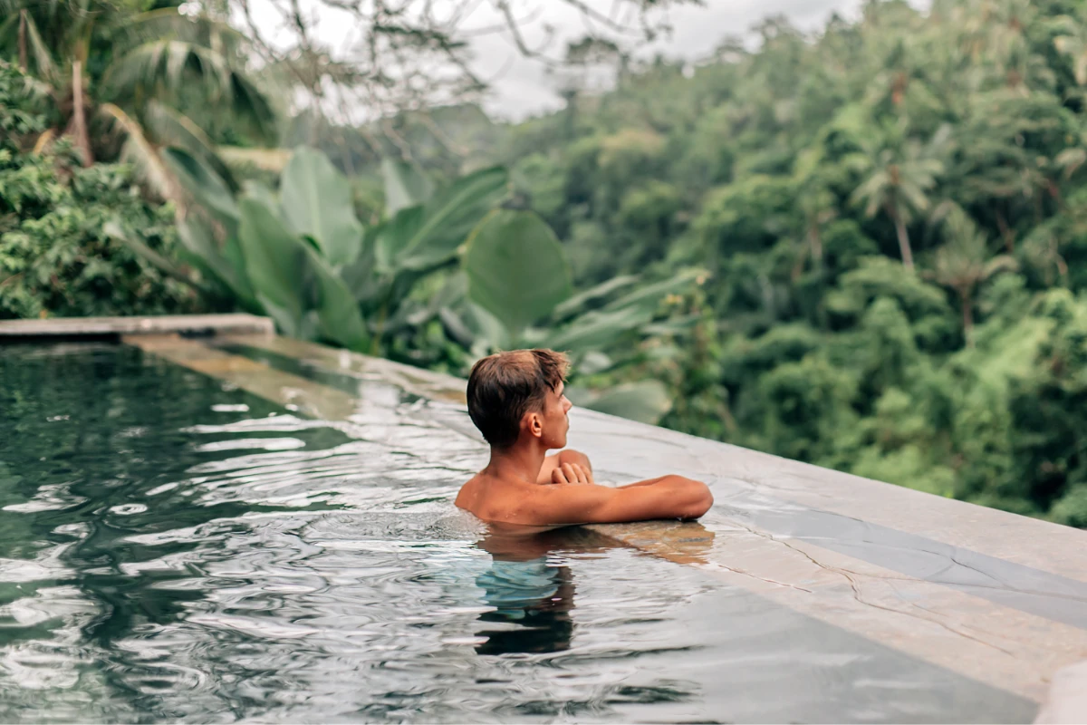 a man in a pool in bali indonesia