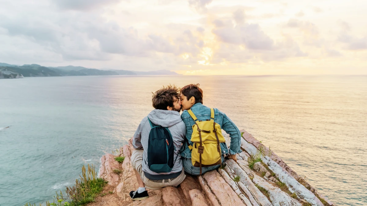 couple kissing on clifftop