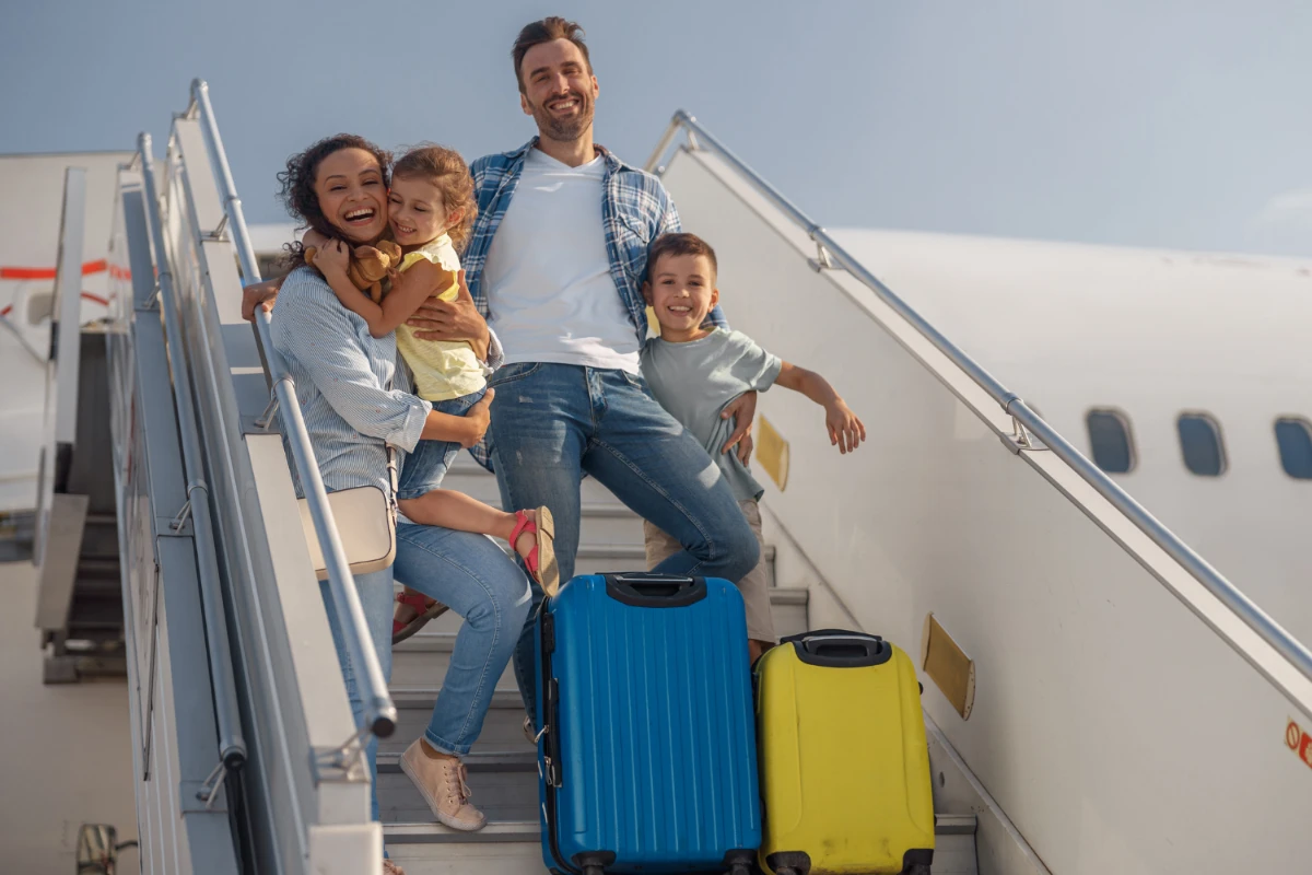 family boarding a plane