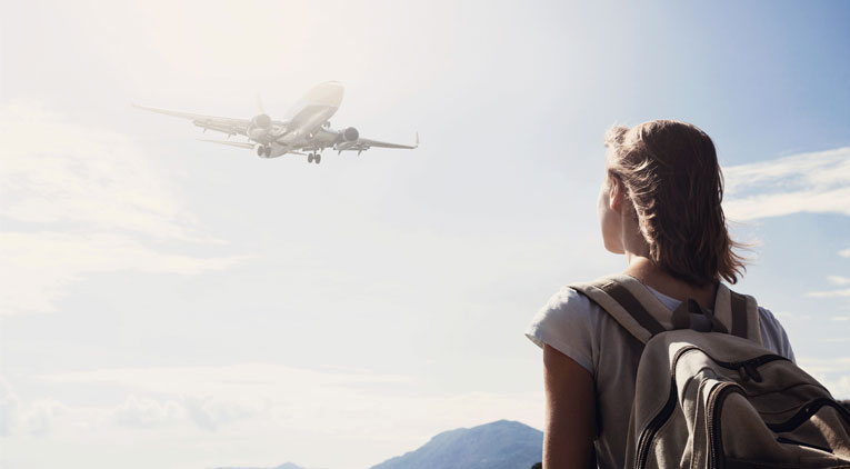 Woman watching plane